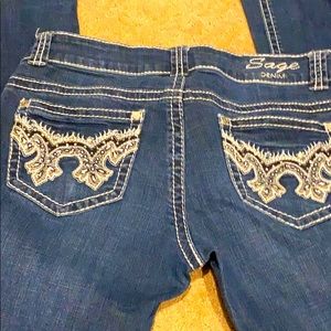 Sage Denim bootcut jeans with bling on pockets.